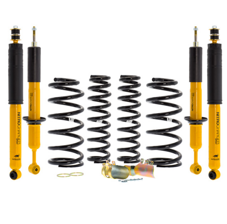 ome suspension kit yellow and black with 4 springs and 4 shock absorbers on white background