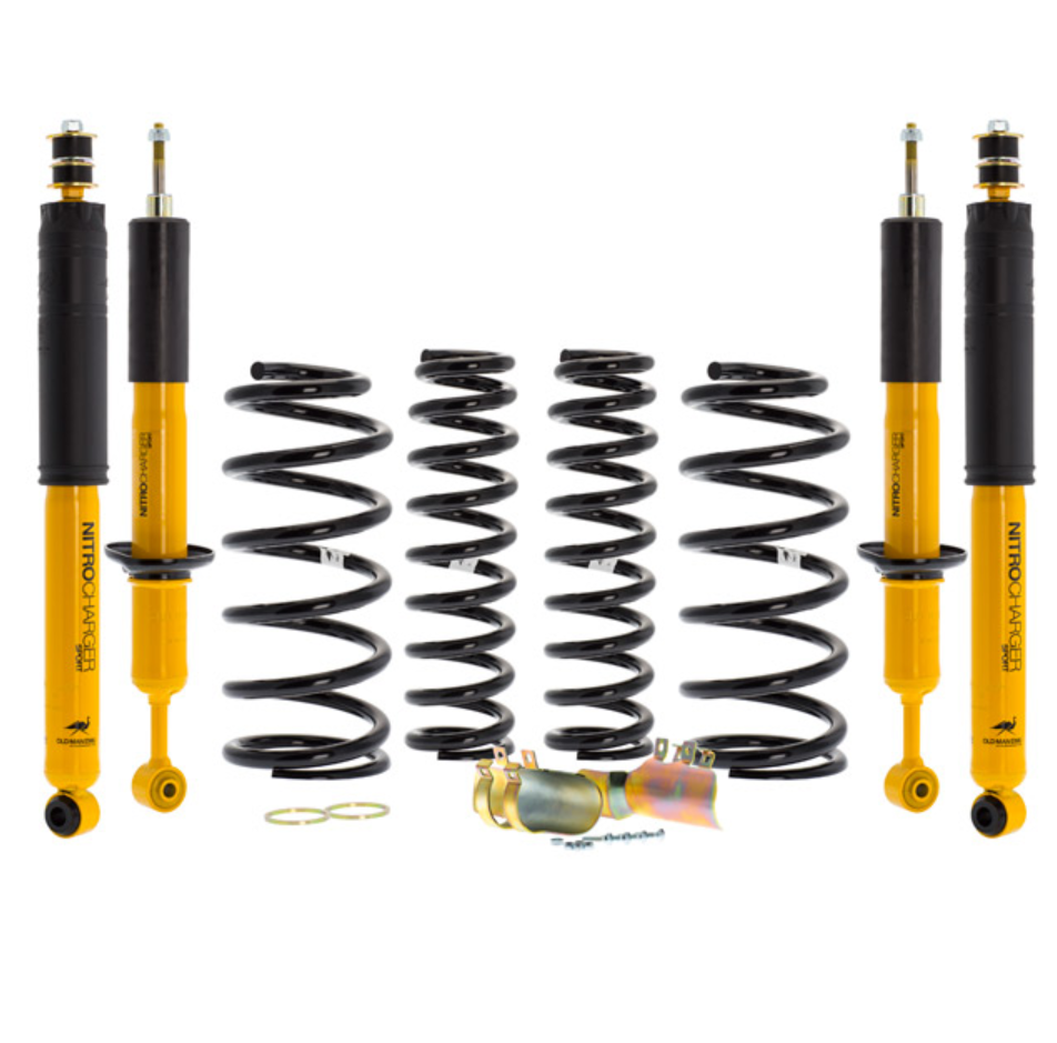 ome suspension kit yellow and black with 4 springs and 4 shock absorbers on white background