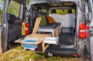 Utility van with pull-out bed