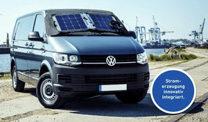 Solar panel mounted on the windscreen of a Vokswagen Transporter sea front