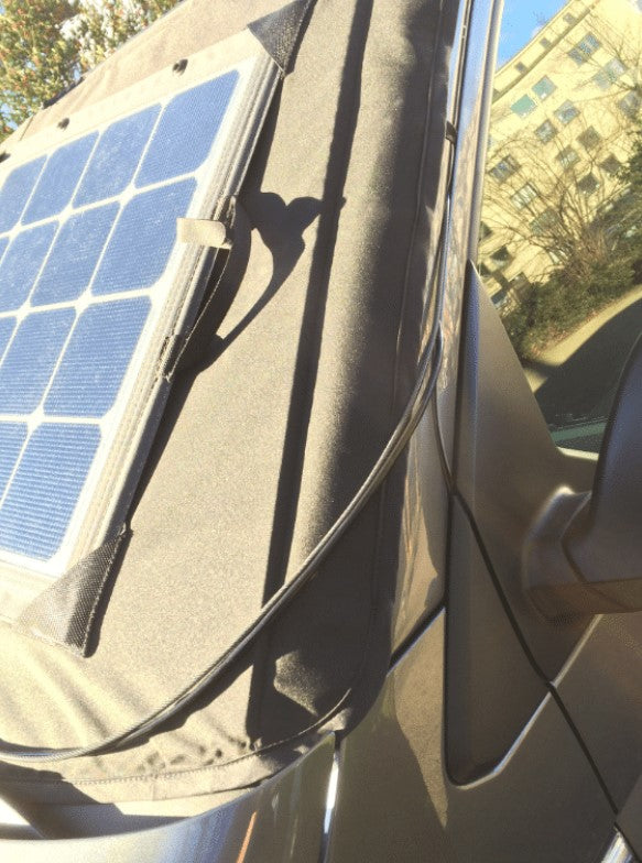 Front side view of a vehicle with a solar-powered windshield cover