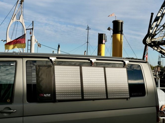 close-up view of a volkswagen transporter rear window with a solara solar panel