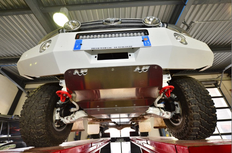 bottom view of a vehicle with armor and white bumper