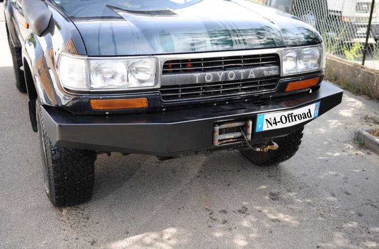 front view of a toyota land cruiser 80 with black steel bumper