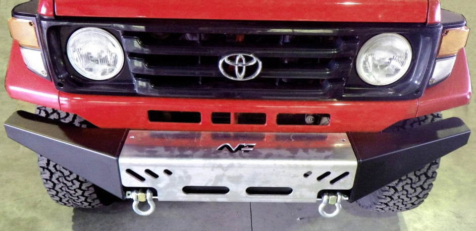 front end of a red toyota with a black bumper