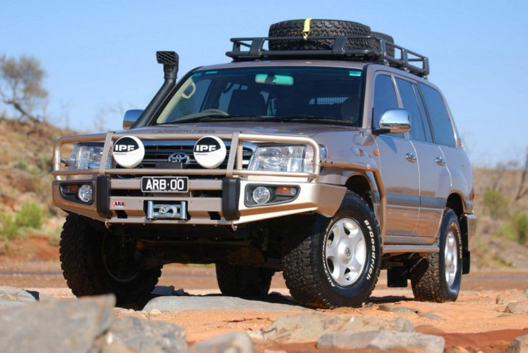 toyota land cruiser 105 in the rock with a steel bumper