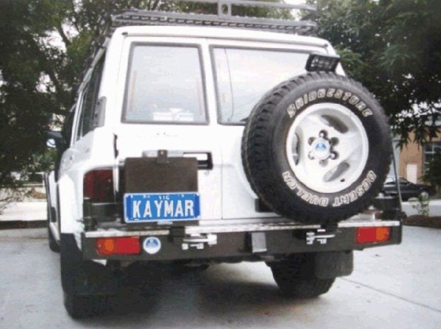 blurred view of a nissan patrol with a kaymar bumper