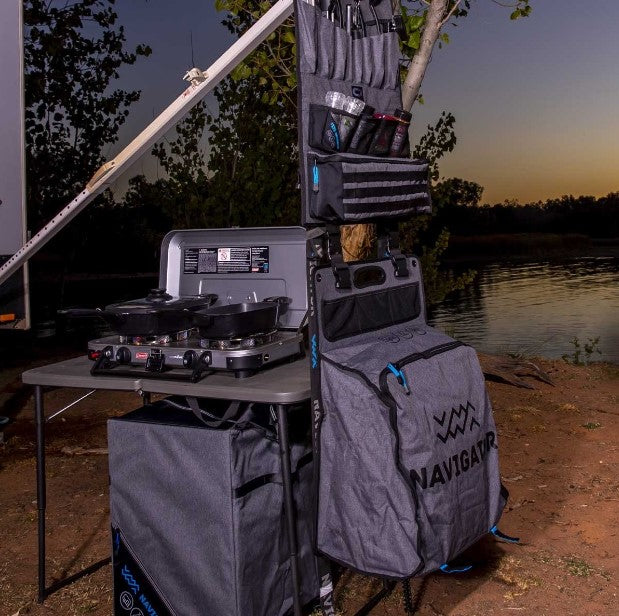 in front of a barbecue lake and storage bags with utensils