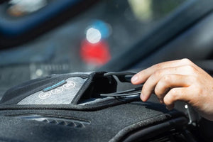 hand holding glasses to put on or remove from pouch navigator