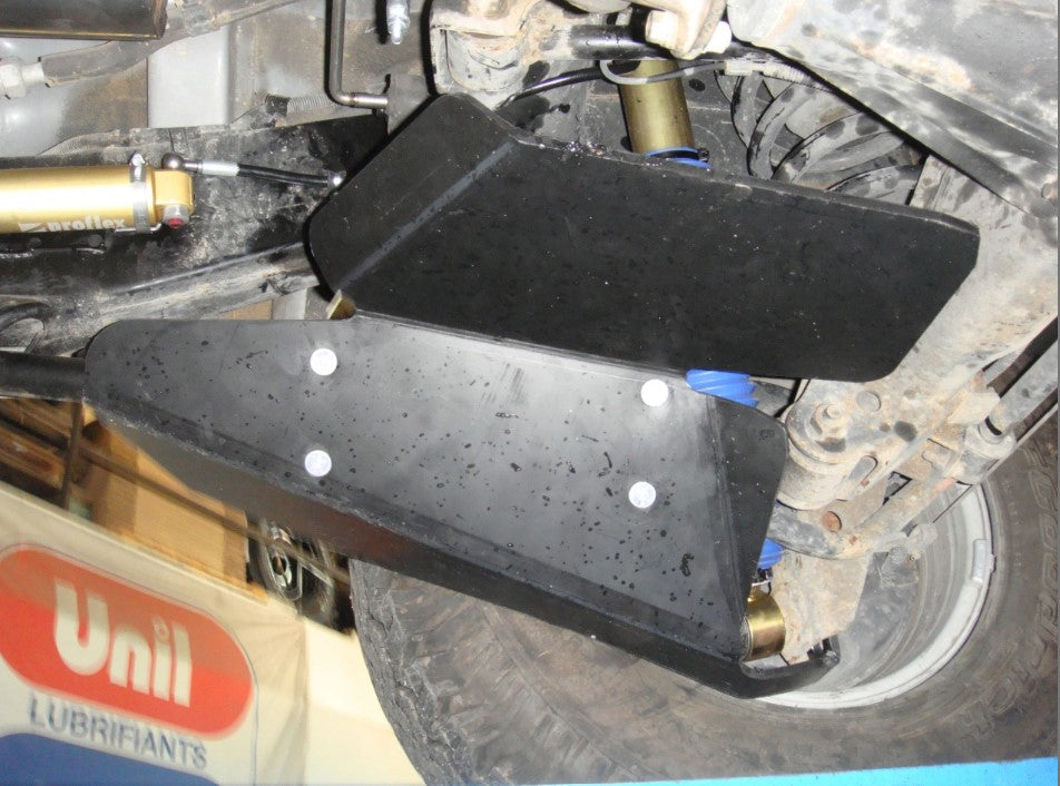 black shock absorber protection fixed under a vehicle to limit breakage