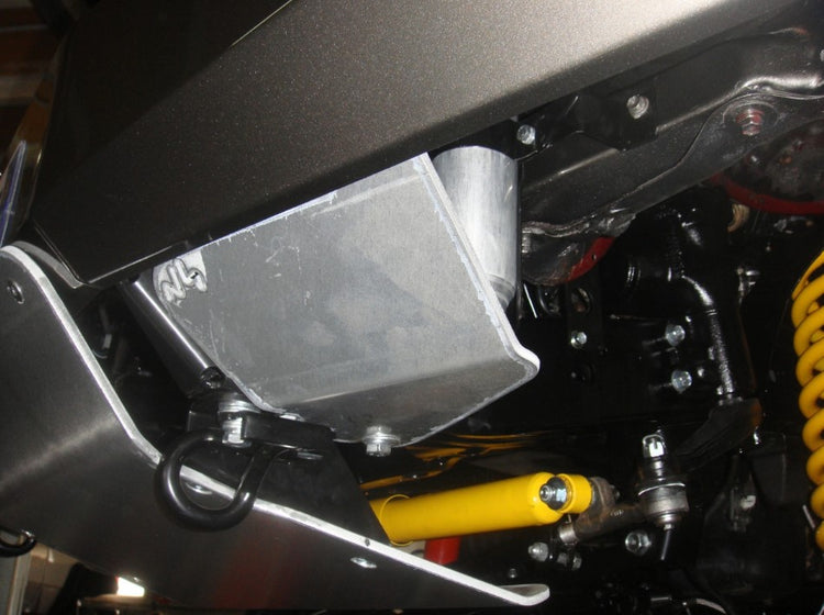 under a clean vehicle with two armors and yellow spring shock absorbers