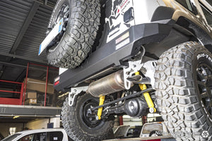 low view of a suzuki jimny in a garage with a black steel bumper