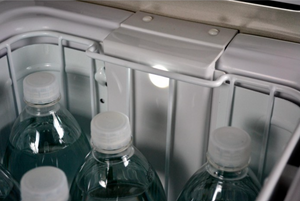 interior of an engel fridge with water bottles