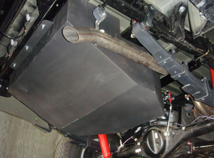 steel tank mounted under a vehicle with red and white shock absorbers
