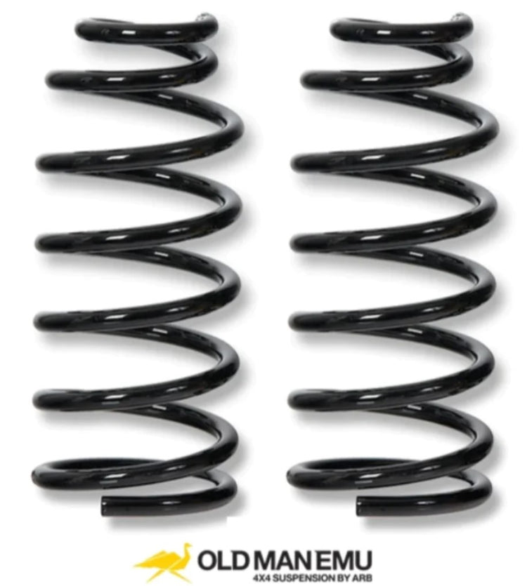 two black coil springs on a white background OME