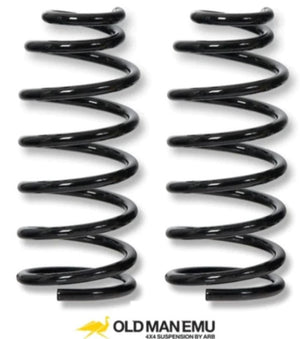 Two black OME springs with yellow logo at bottom