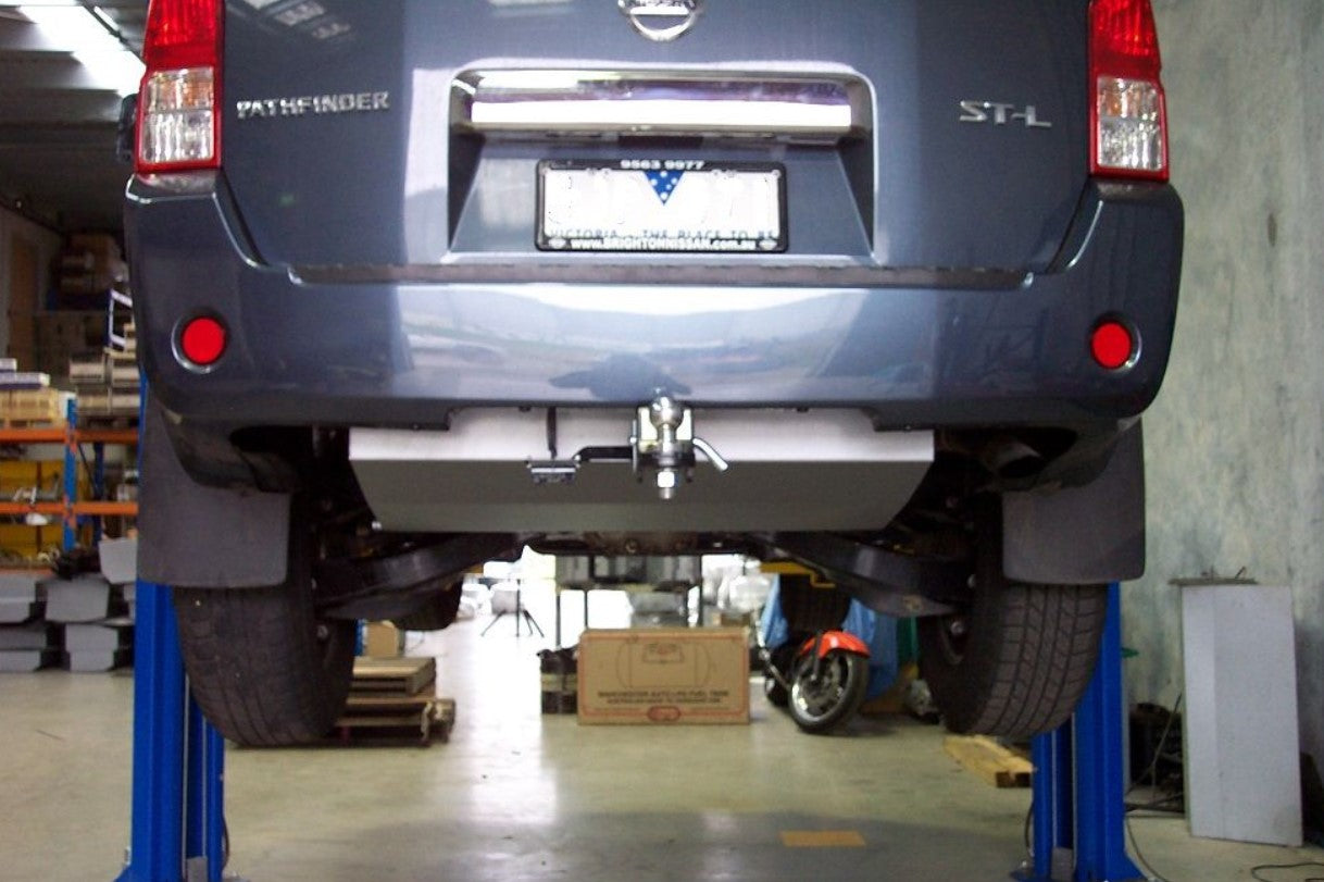 Rear view of a blue Nissan Pathfinder on a bridge