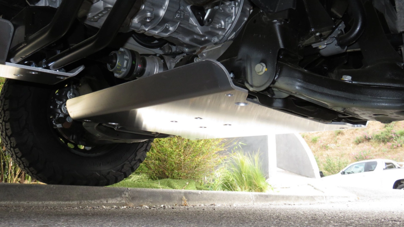 view of the underside of the vehicle with an aluminum skid plate 