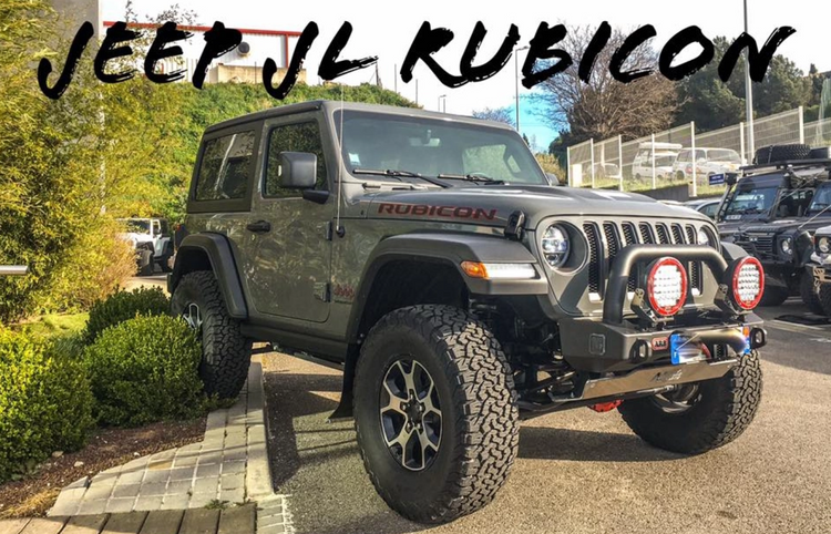 jeep jl rubicon equipped parked on road and sidewalk