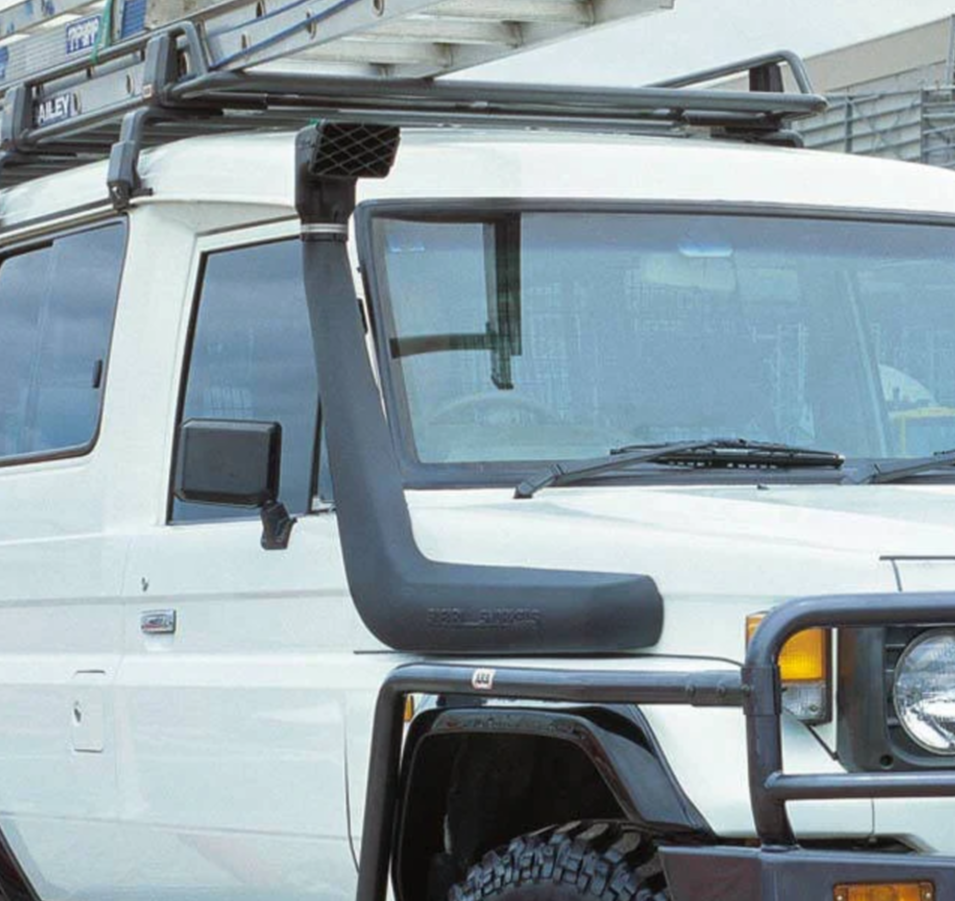 close-up view of a white land cruiser with a black snorkel