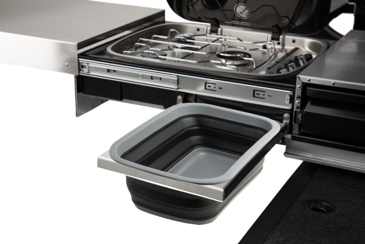 gas stove with plastic sink on a drawer
