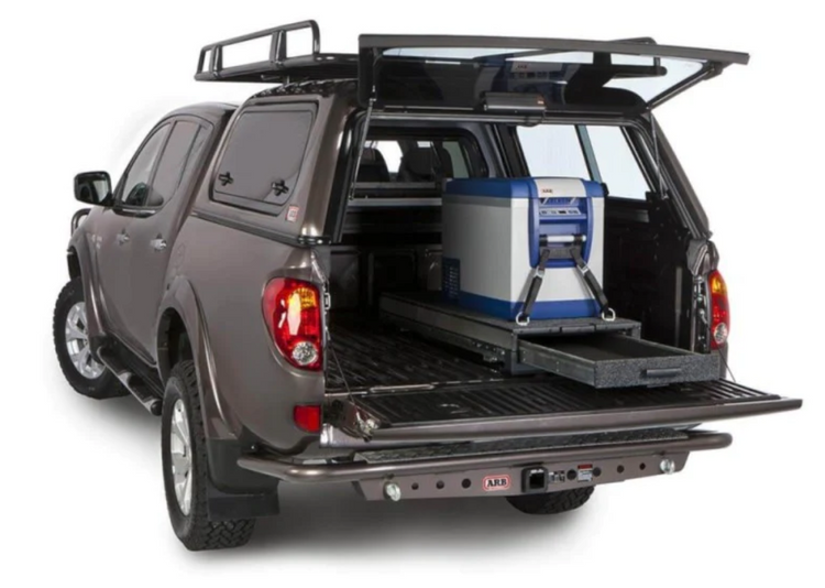 brown pick up with a drawer that supports a fridge in the Bed Truck of the vehicle