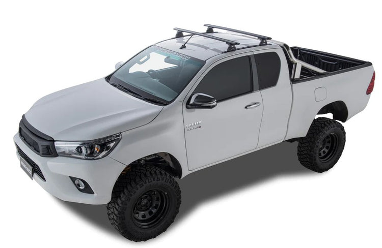 White Toyota Hilux with roof racks