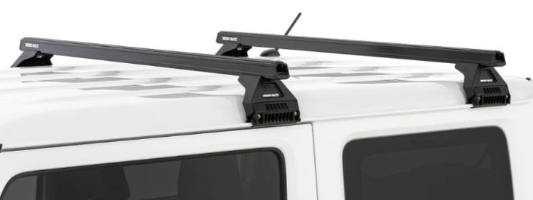 two black square roof bars on the roof of a white vehicle