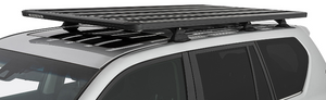 black roof rack on the roof of a grey land cruiser with key fasteners