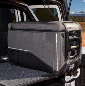 ARB fridge with cover in a vehicle in a desert